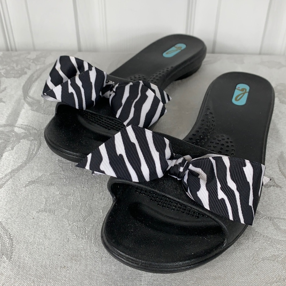 NWOT OKAb man made sandal black. Black/white bow